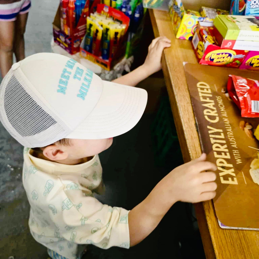 child wearing teal fini meet me at the milkbar kids streetwear look